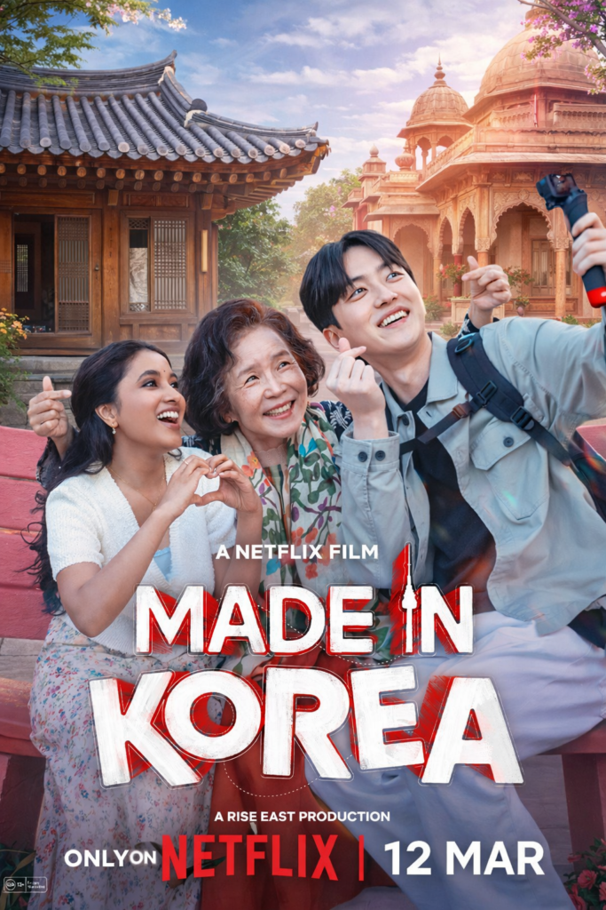 Three people taking a selfie in front of a Korean hanok on the left and an Indian traditional house on the right, symbolizing cultural connection