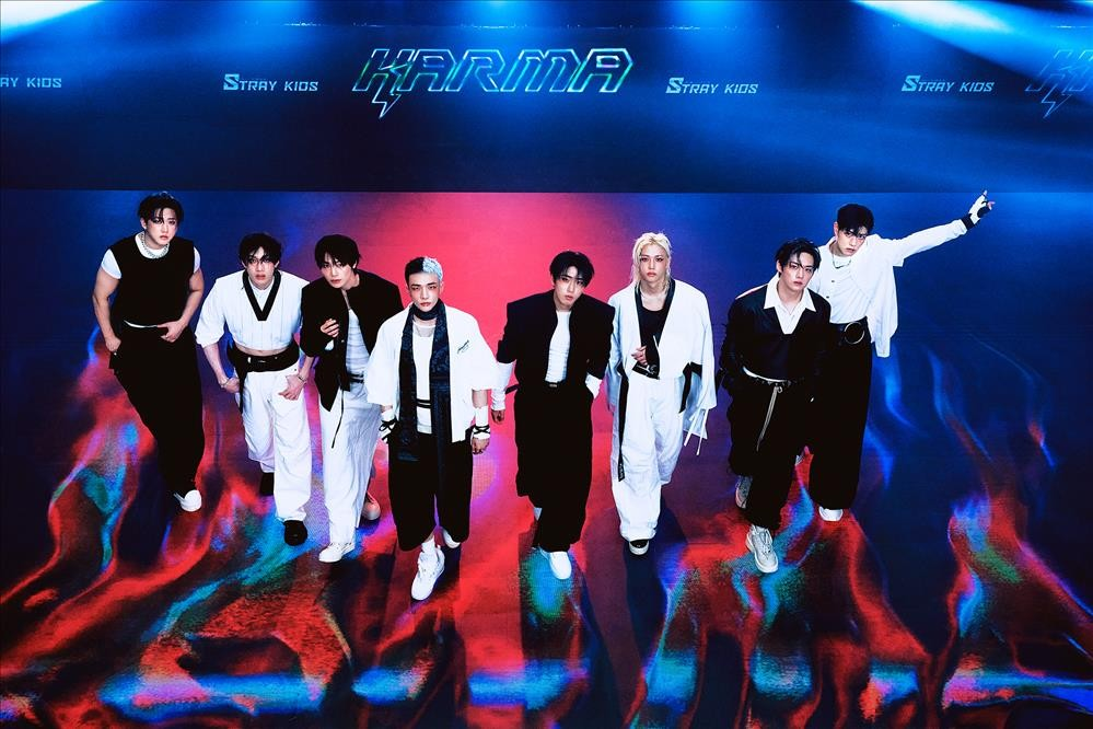 Stray Kids members posing for the 2025 'Karma' album, the group that surpassed records with most #1 albums in the 21st century.
