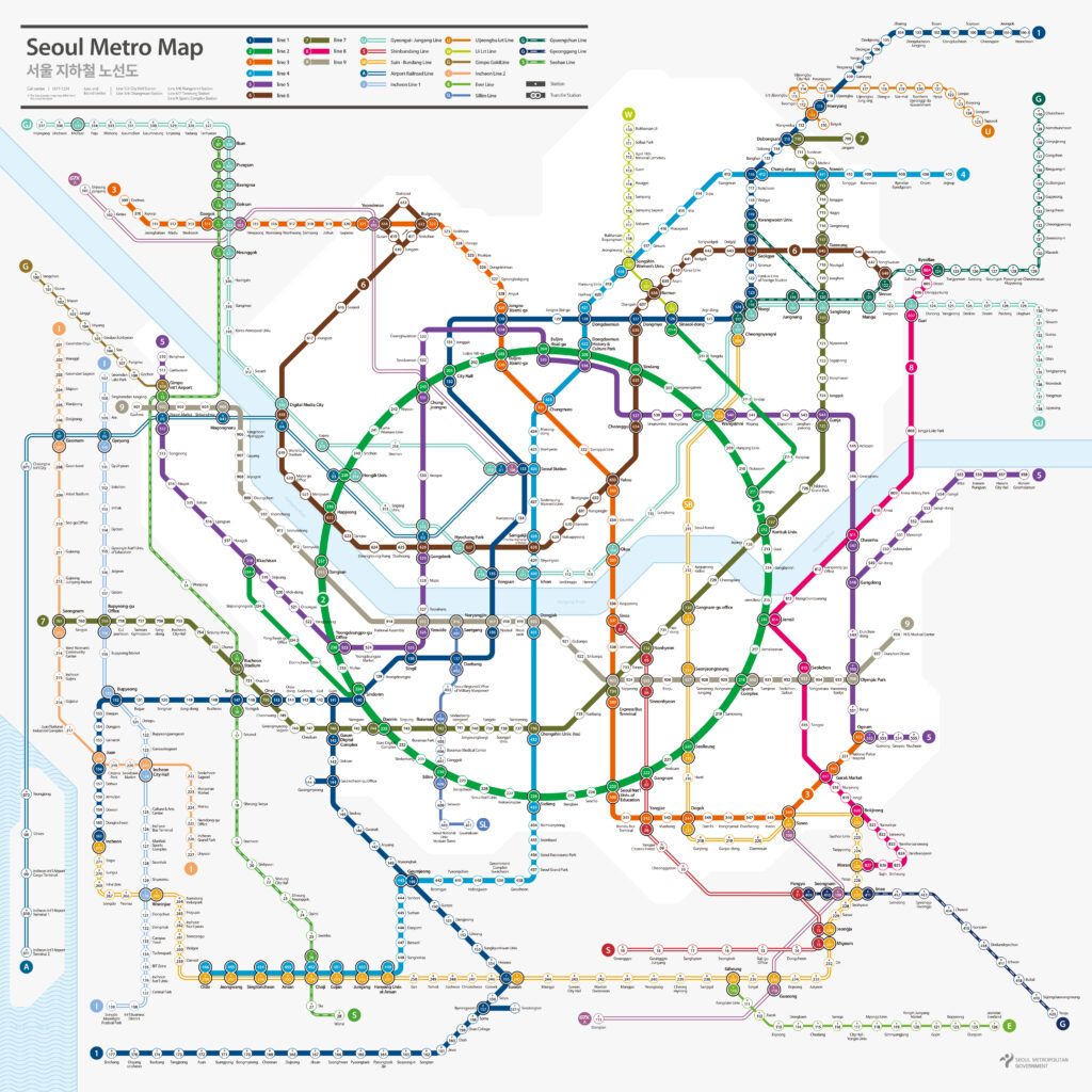 ​A comprehensive and high-resolution official English map of the Seoul Metro system. It features a colorful and organized web of subway lines, including Lines 1 through 9, the Gyeongui-Jungang Line, the Bundang Line, and the Airport Railroad (AREX). Each line is clearly color-coded (e.g., Line 2 in green, Line 4 in blue) with station names written in clear English and Korean. Major transfer hubs like Seoul Station, Gangnam, and Hongik Univ. are highlighted with distinct icons. The map includes the Han River flowing through the center, providing a geographical reference for travelers. At the bottom right, the official logo of the Seoul Metropolitan Government and Seoul Metro is visible, confirming its authenticity.